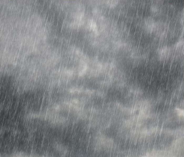 dark gray cloudy background with torrential downpour rain overlay